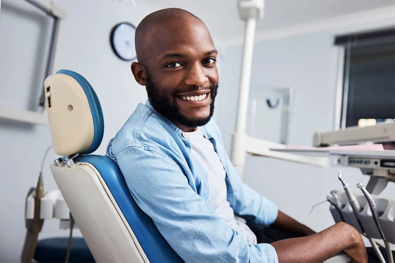 Patient seated in a modern dental treatment room