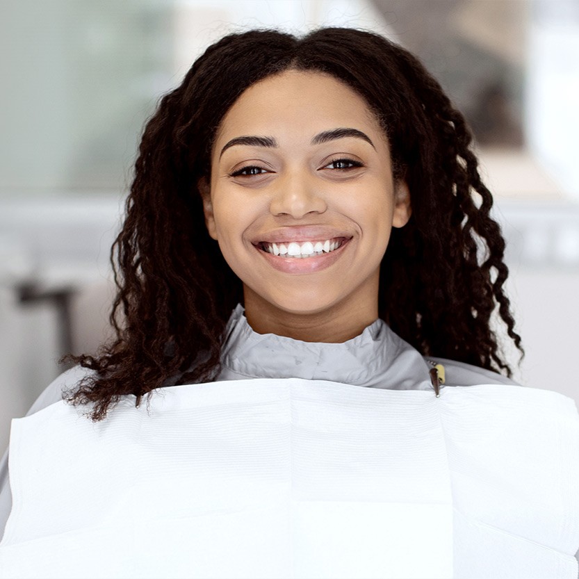 Patient smiling in a dental chair