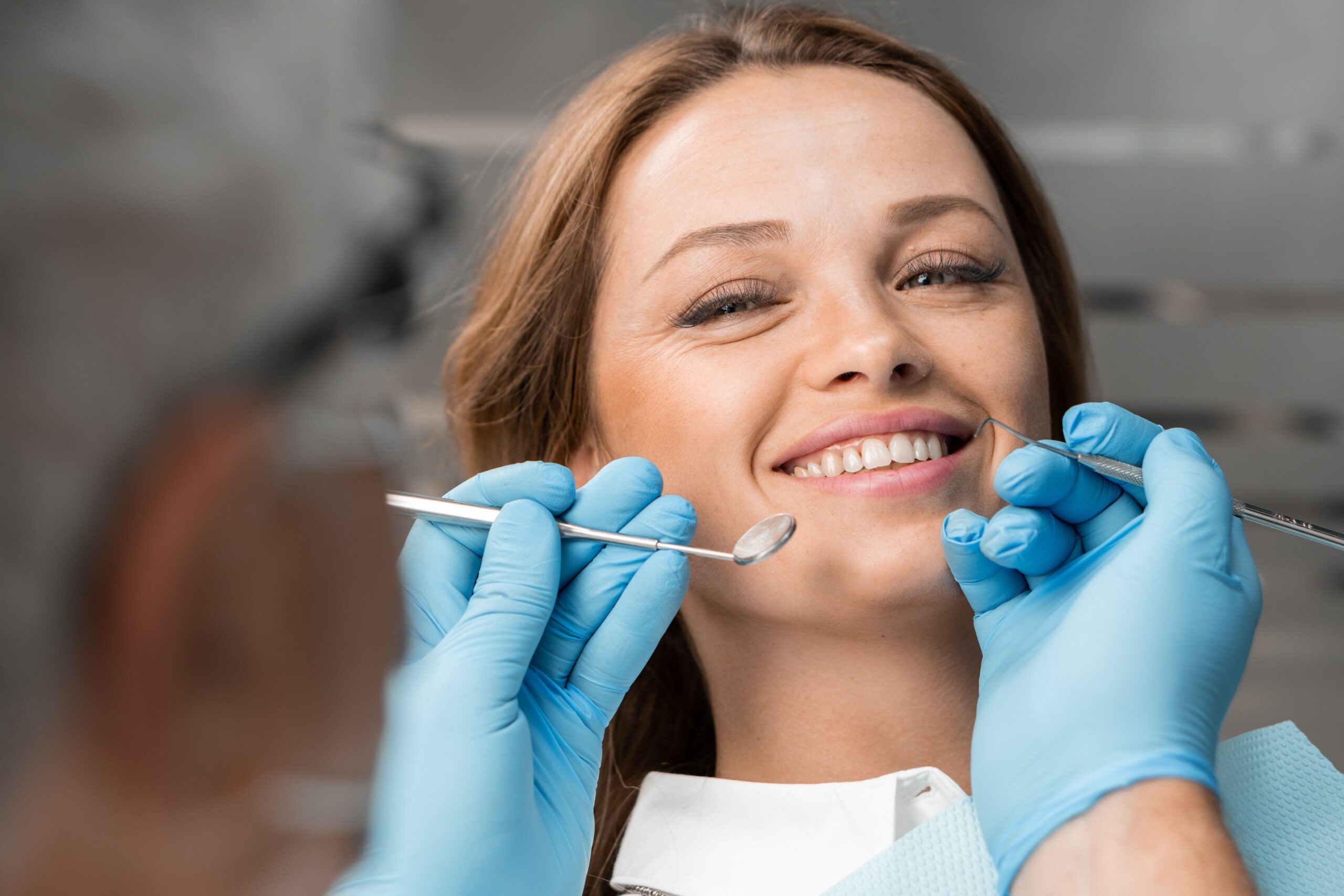 Dentist examining a patient during a preventive visit